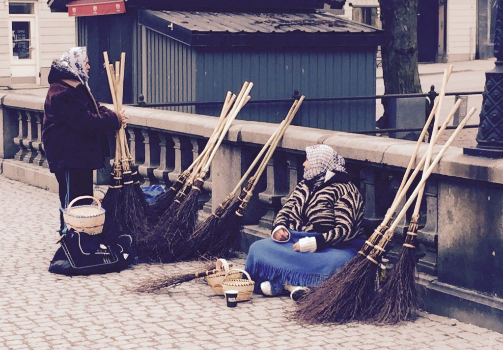 "Roma women selling Easter witch broomsticks in Uppsala" by radiowood is licensed under CC BY-NC 2.0.