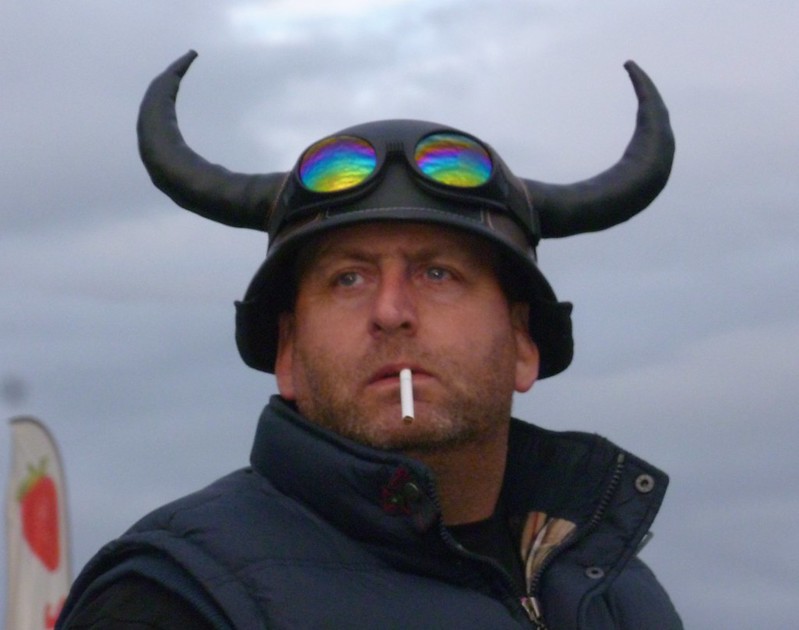 "Smoking Man with Horns" by Adrian Wallett is licensed under CC BY-NC-SA 2.0.